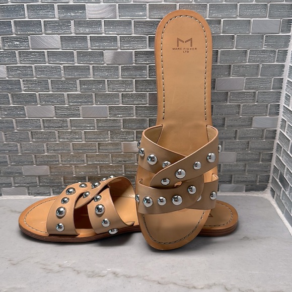 Marc Fisher Shoes - Marc Fisher tan leather slide sandals with silver grommet accents. Size 9.5.